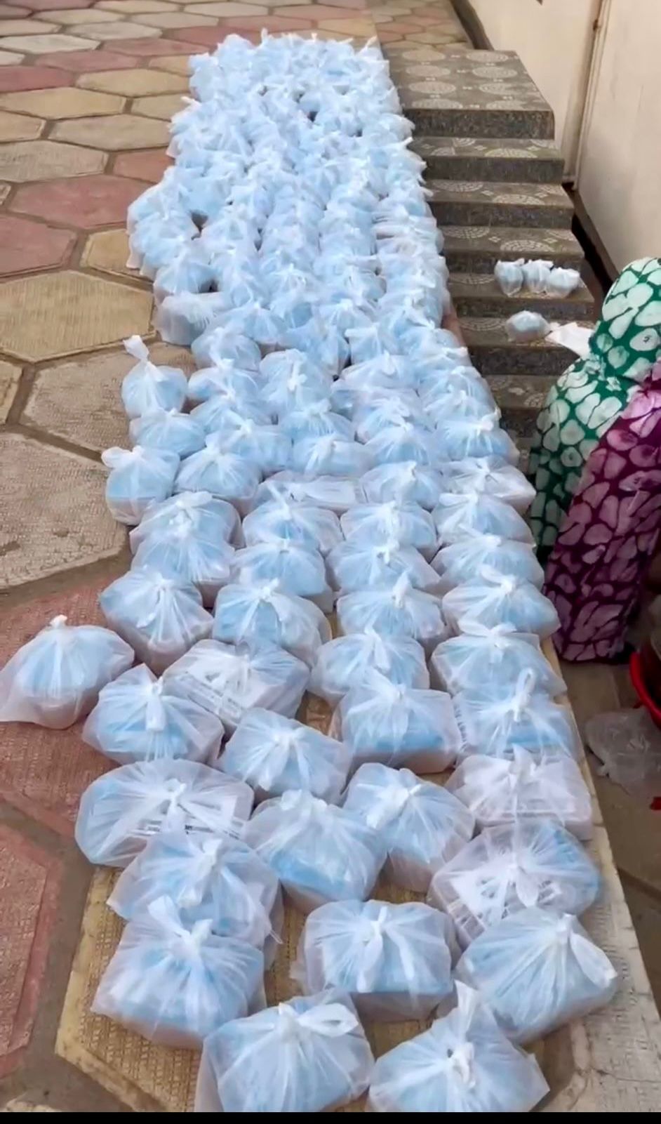 Food parcels laid out in rows before distribution