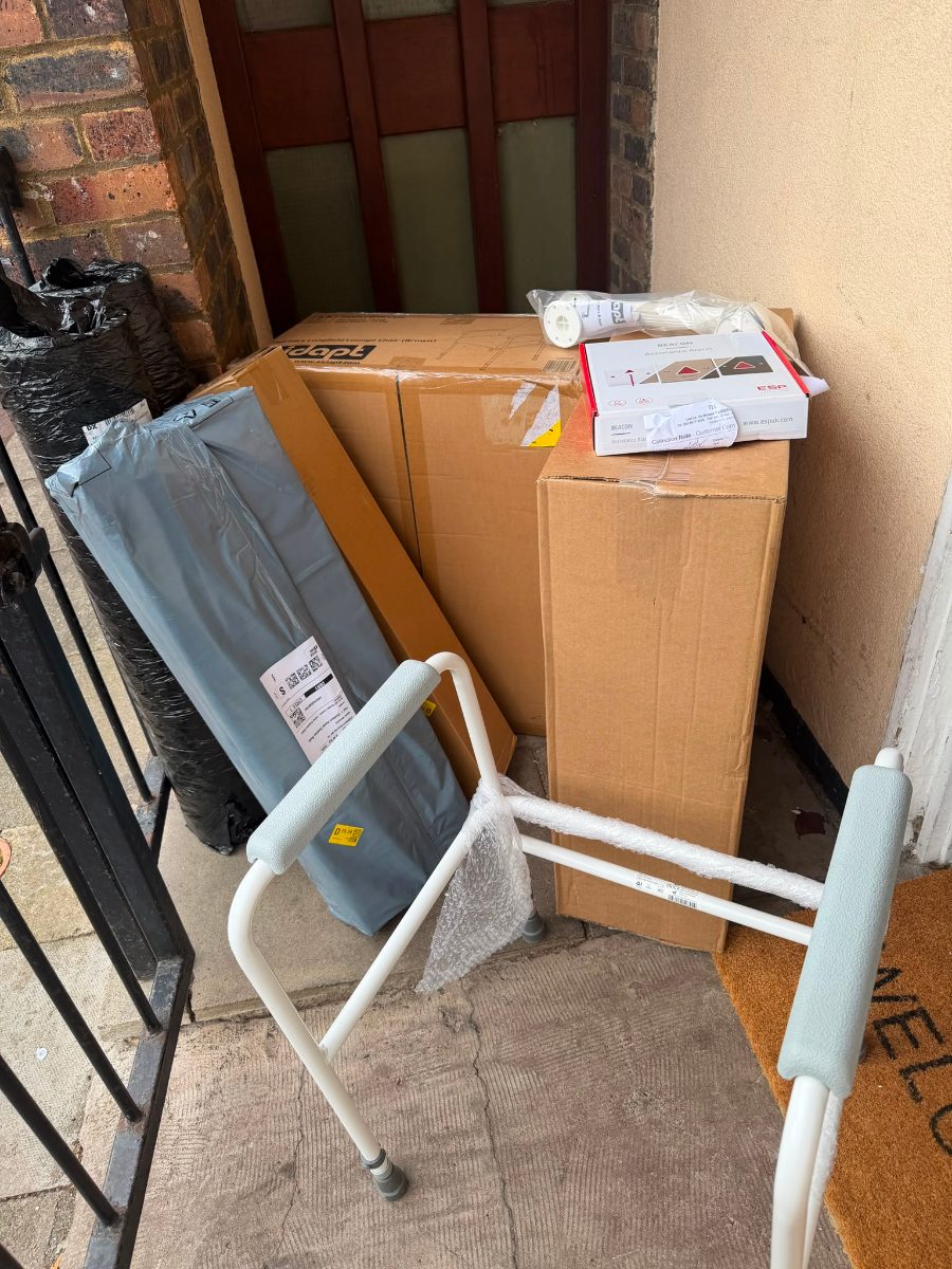 Equipment delivered to the mosque: a toilet support frame, a boxed high-back chair and an emergency assistance alarm
